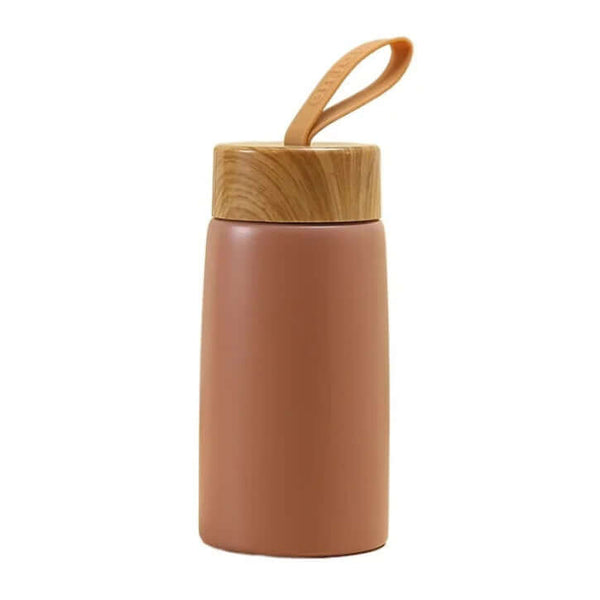 Mini Wood Cover Thermos Cup by Arbora Casa showing a compact stainless steel thermos with a wooden cover and lid on a neutral background.