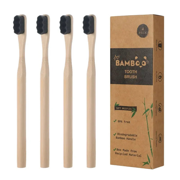 Set of 4 biodegradable bamboo toothbrushes by Arbora Casa with natural bamboo handles and soft bristle heads.